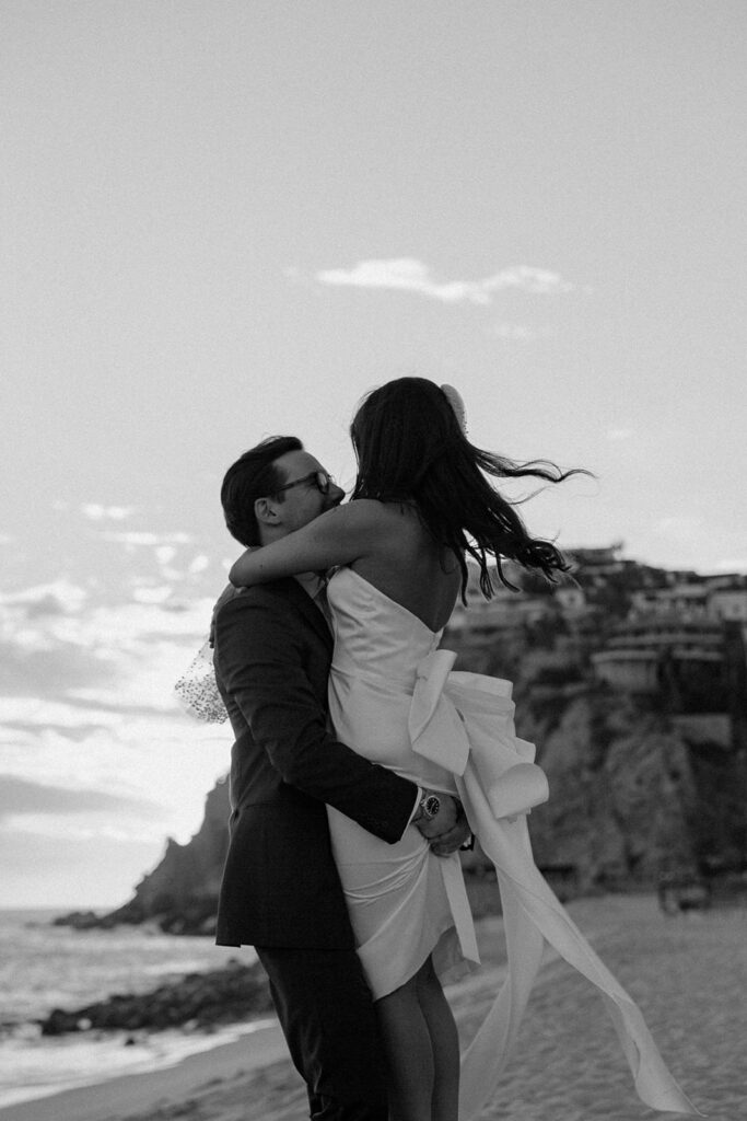 couple twirls at beach Mexico destination wedding