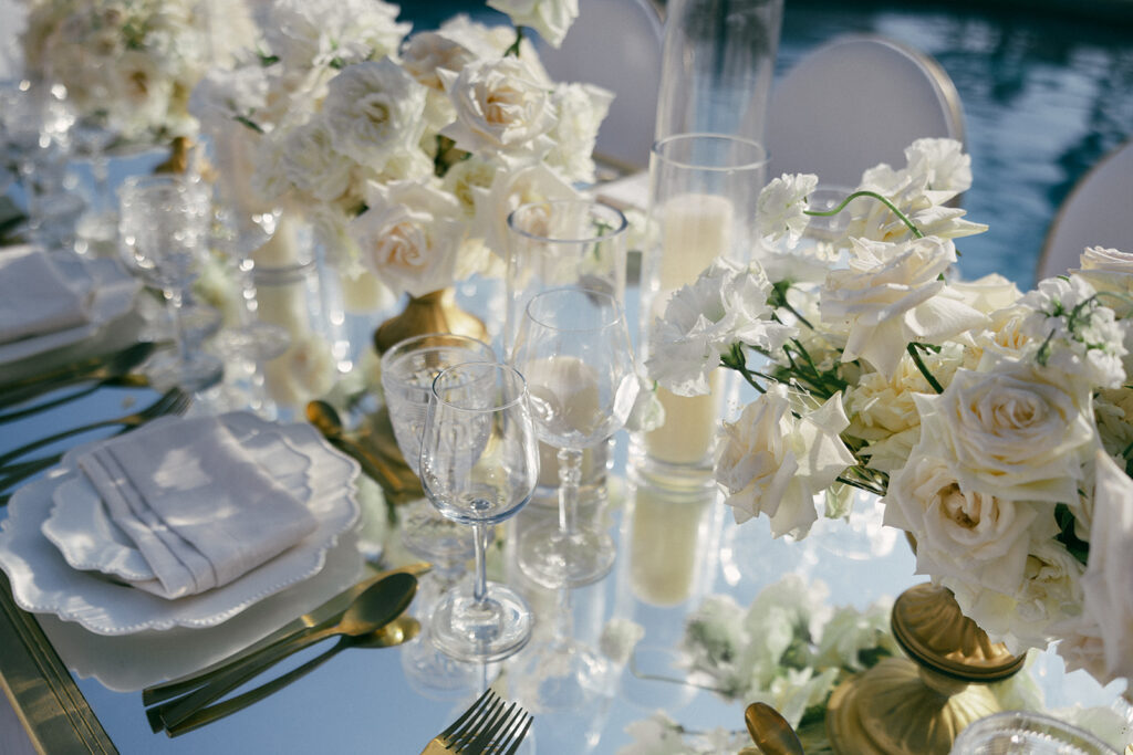 white flowers and candles on wedding reception table