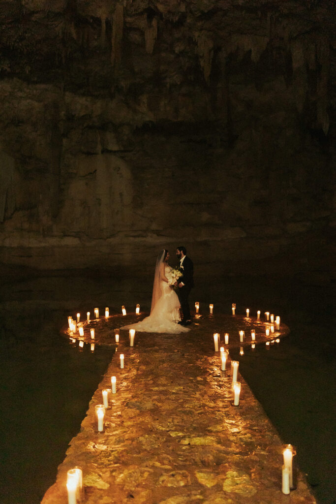 couple exchanges vows at candlelit wedding ceremony photographed by traveling photographers