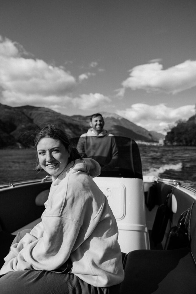 destination wedding photographer rides boat to photograph wedding couple