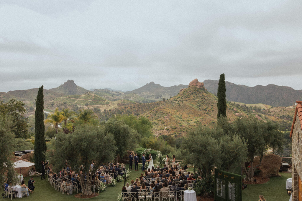 backyard wedding surrounded by green rolling hills 