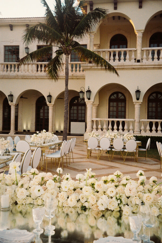white rose wedding floral decor at wedding reception 
