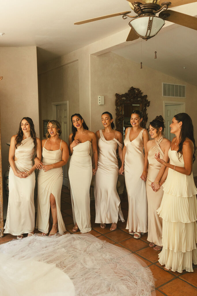 bridesmaids close eyes for bride wedding dress reveal