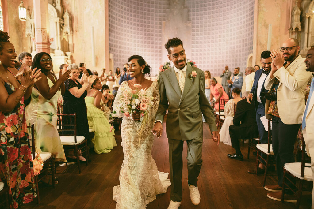 couple walks down aisle at Hotel Peter and Paul New Orleans wedding