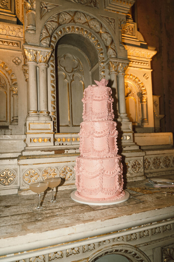 pink vintage three-tier wedding cake at Hotel Peter and Paul