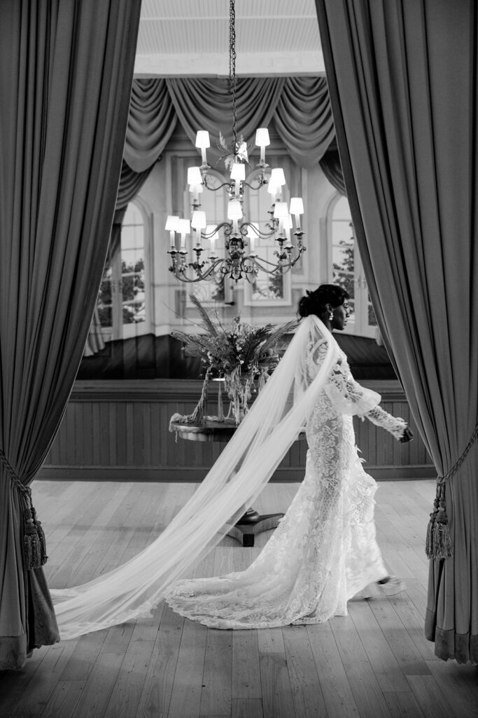 bride walks across hall in white wedding dress