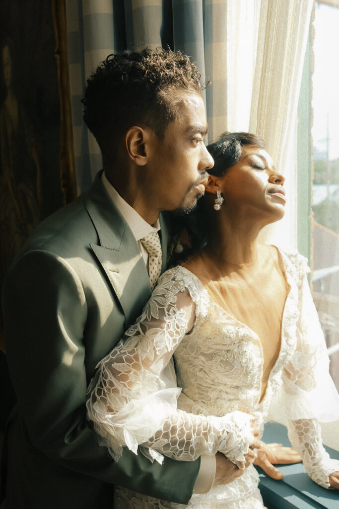 couple embraces at Hotel Peter and Paul New Orleans wedding