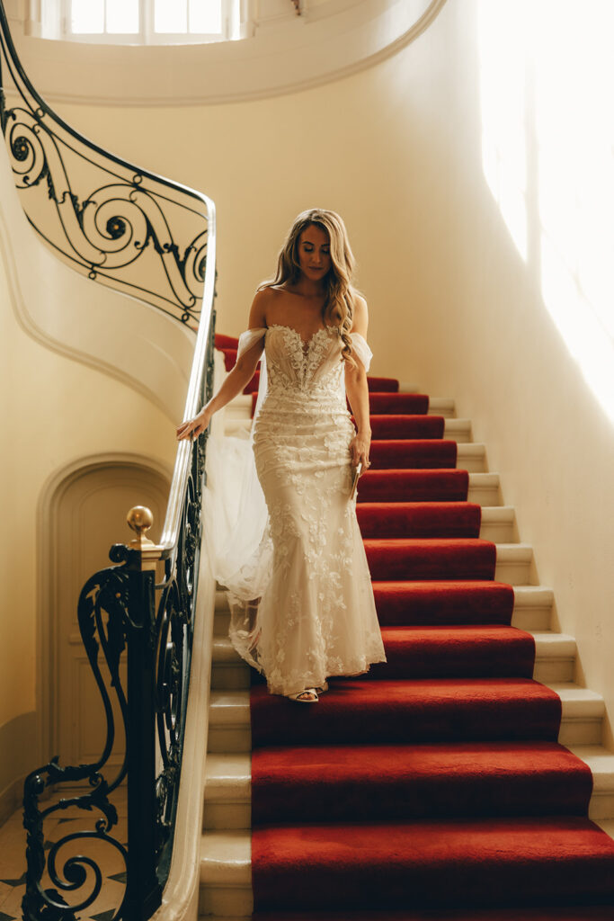 bride walks down staircase