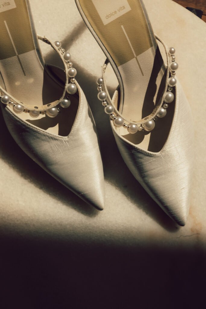 pearl bride shoes in the sunlight and shadows 