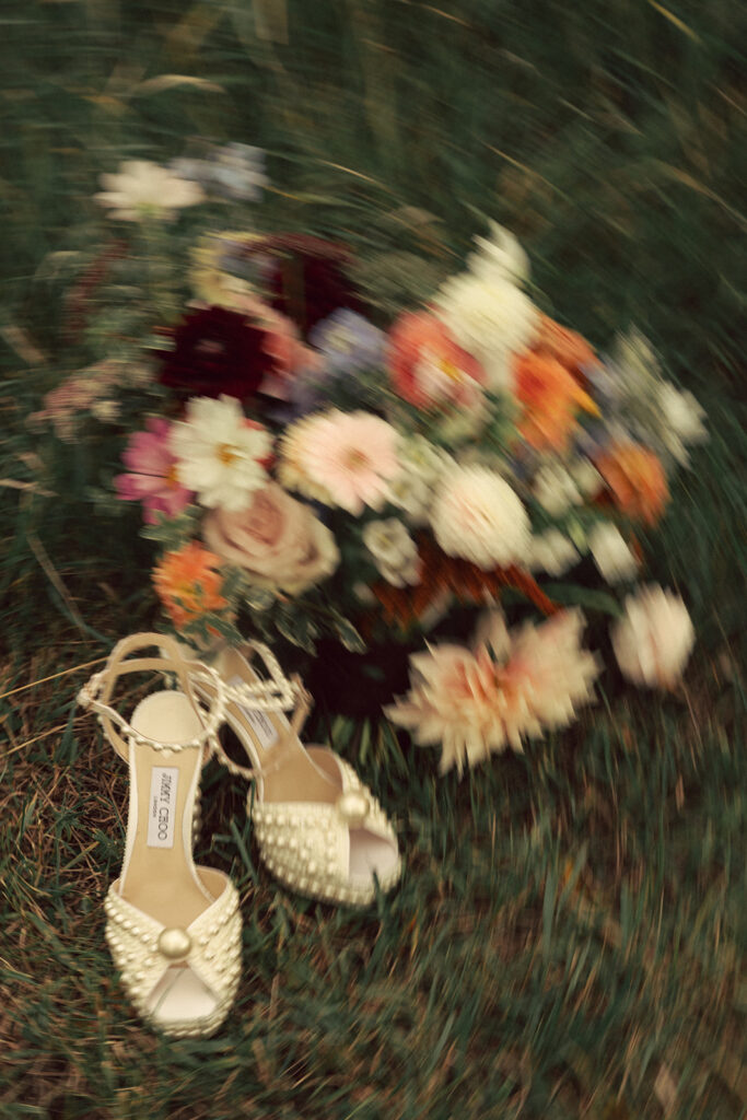 colorful wedding bouquet with pearl-covered shoes