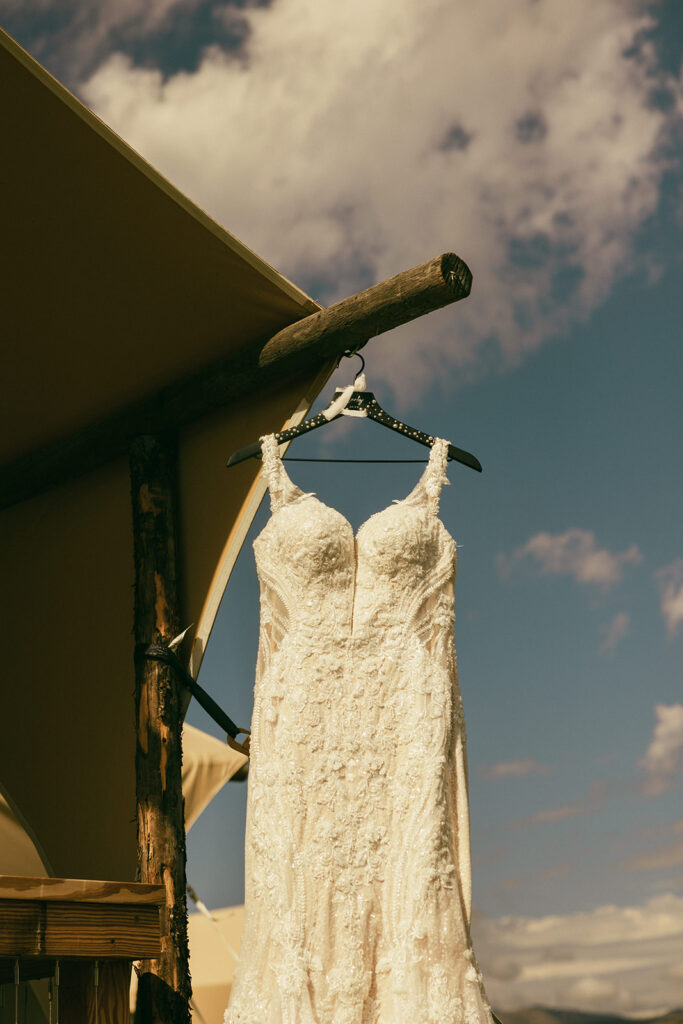 wedding dress hangs on hanger 