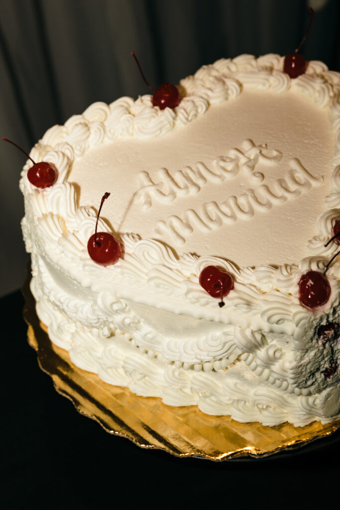 vintage almost married wedding cake with red cherries