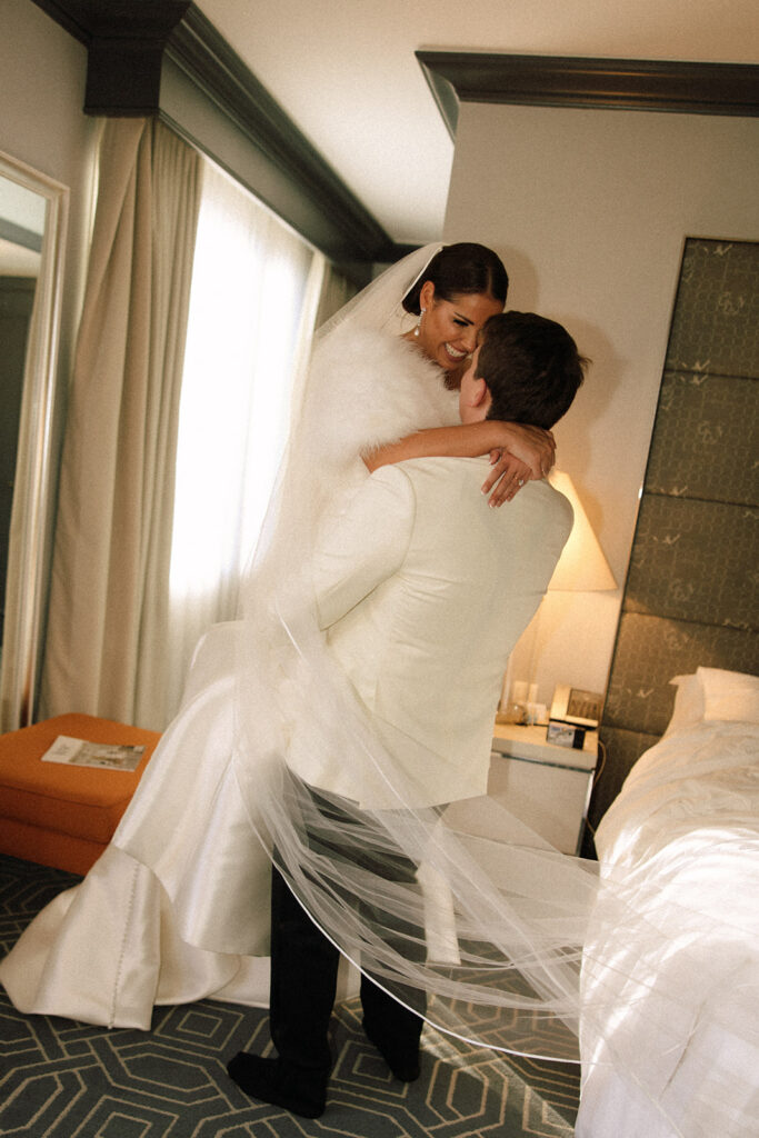 couple embraces in hotel room 