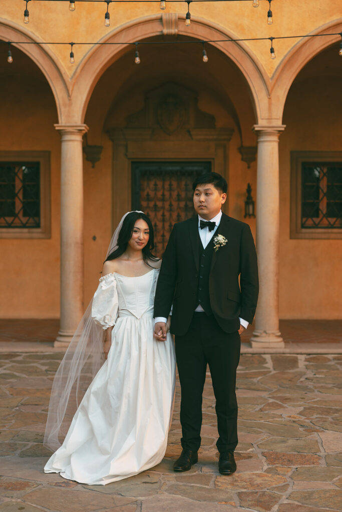 couple holds hands at California weding venue