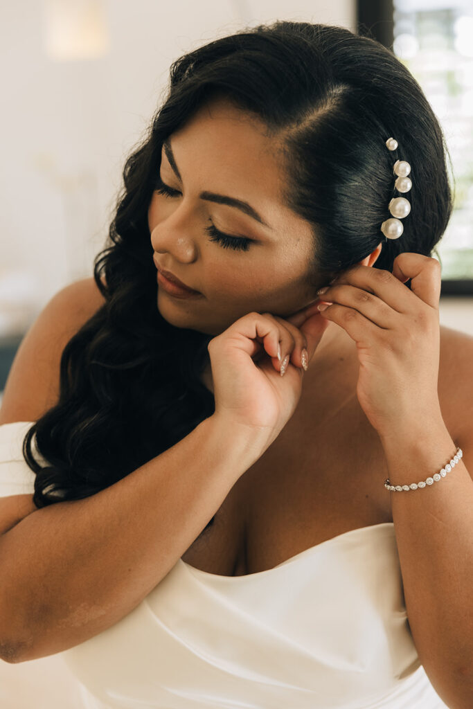 bride gets ready with pearl hairpiece 