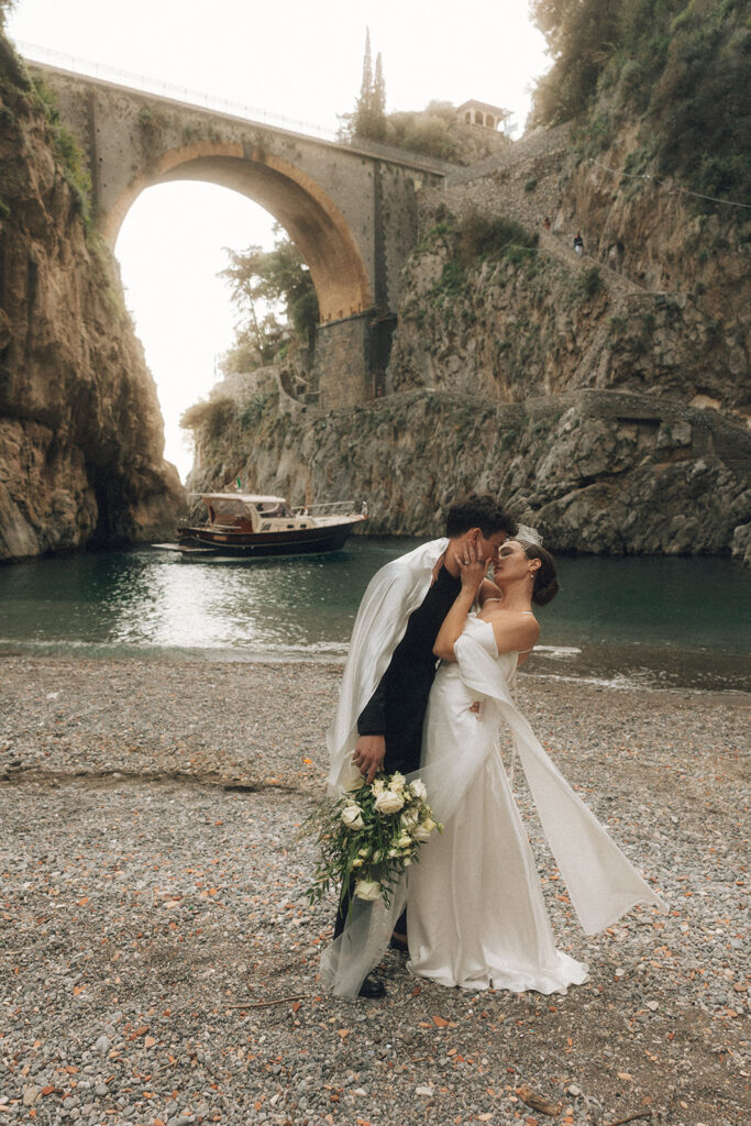 couple embraces at Amalfi coast sunset elopement