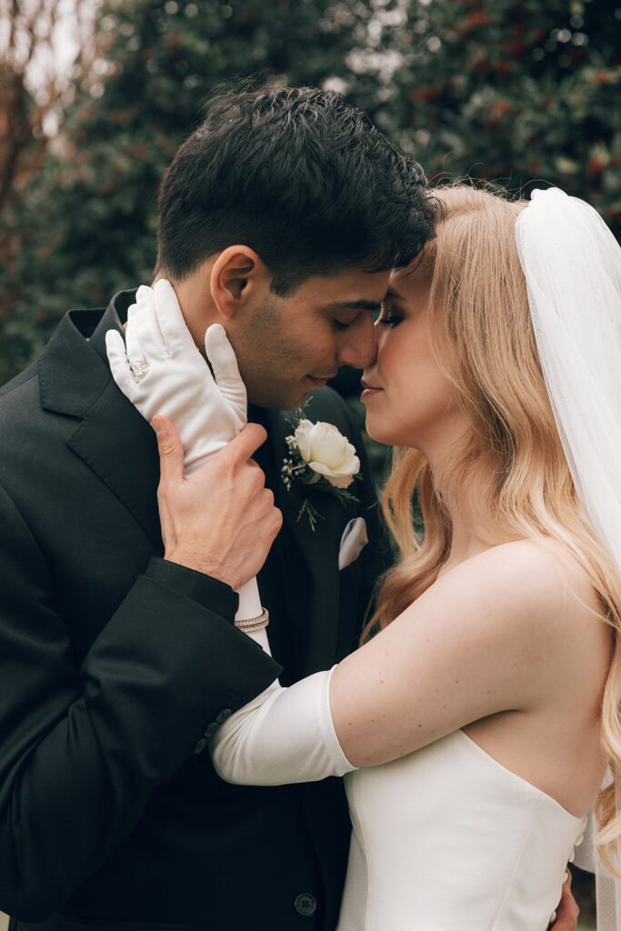 couple kisses on wedding day