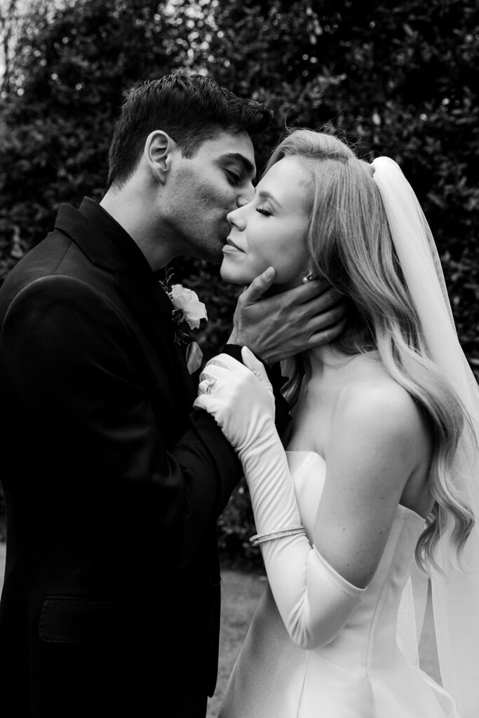 couple kisses on wedding day