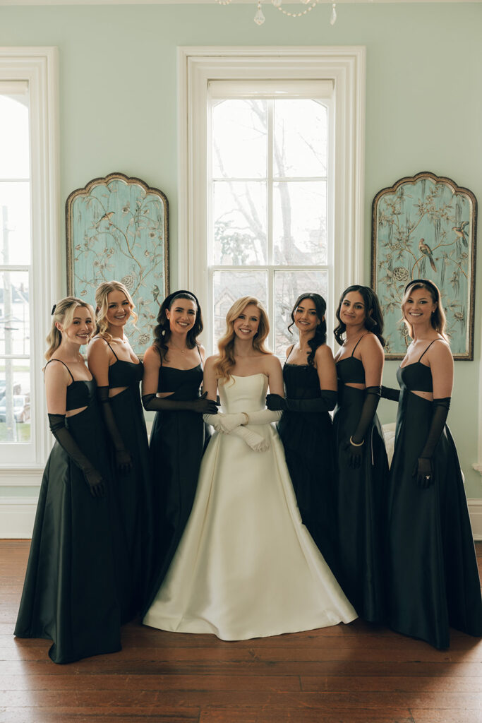 bride stands with bridesmaids at The Merrimon-Wynne House