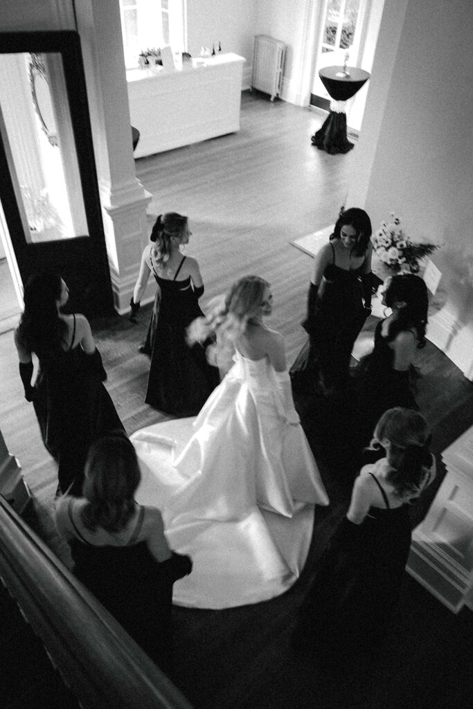 bride twirls surrounded by bridesmaids