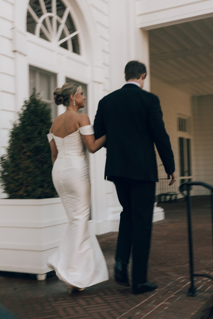 couple walks along grounds at The Duke Mansion Charlotte