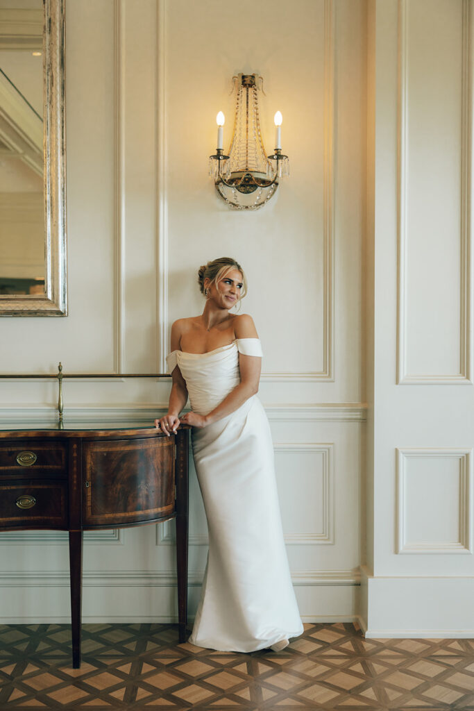 bride poses against wall at The Duke Mansion Charlotte